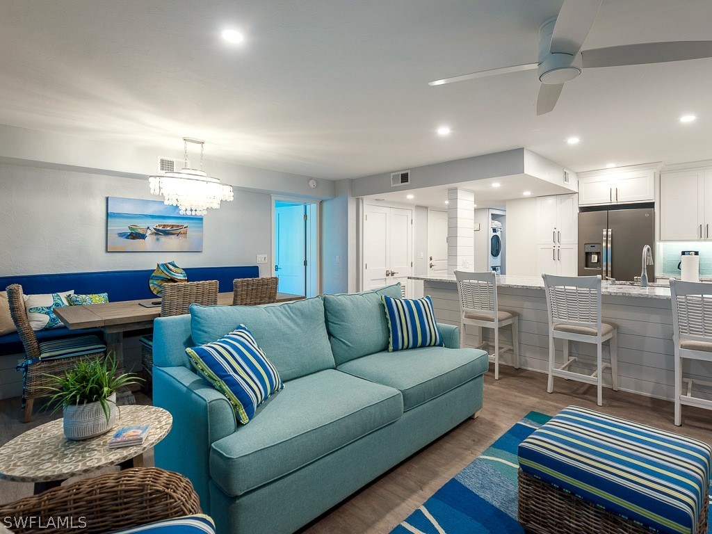760 Sextant Drive, Unit 732 Sanibel, FL 33957 - Photo 7 of 35 a living room with furniture kitchen view and a table