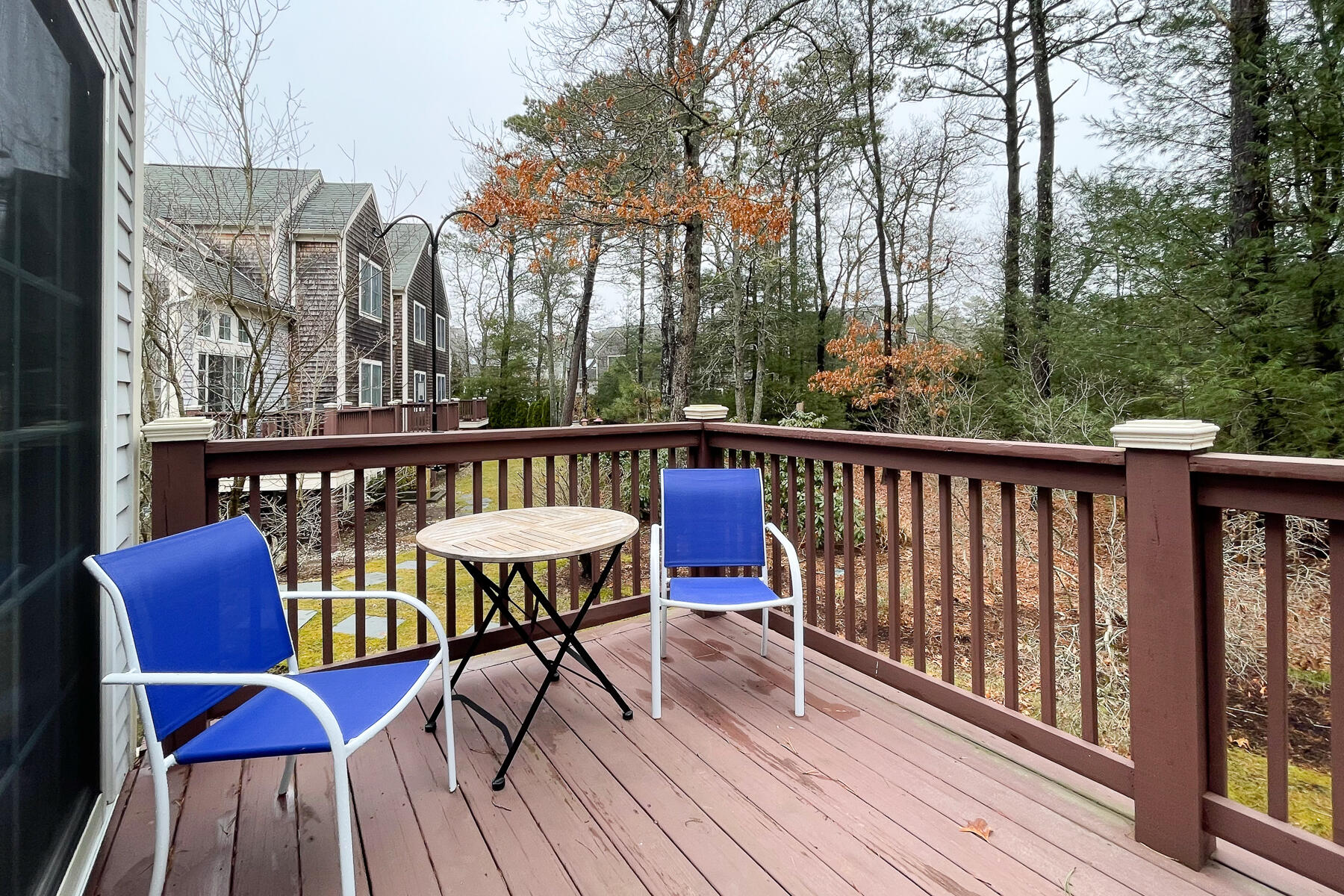 23 Gold Leaf Lane Mashpee, MA 02649 - Photo 27 of 33 a view of a chairs on deck with wooden floor and fence