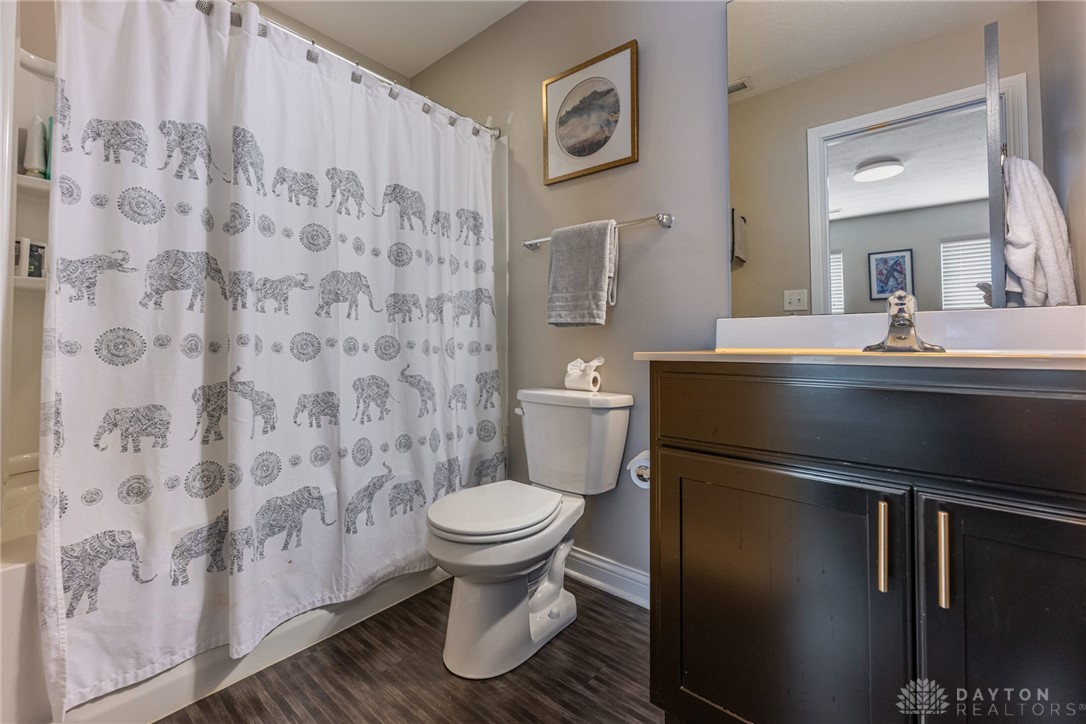 407 Brownstone Row Springboro, OH 45066 - Photo 42 of 54 This functional bathroom features a shower-tub combo and sleek vanity with a classic design.