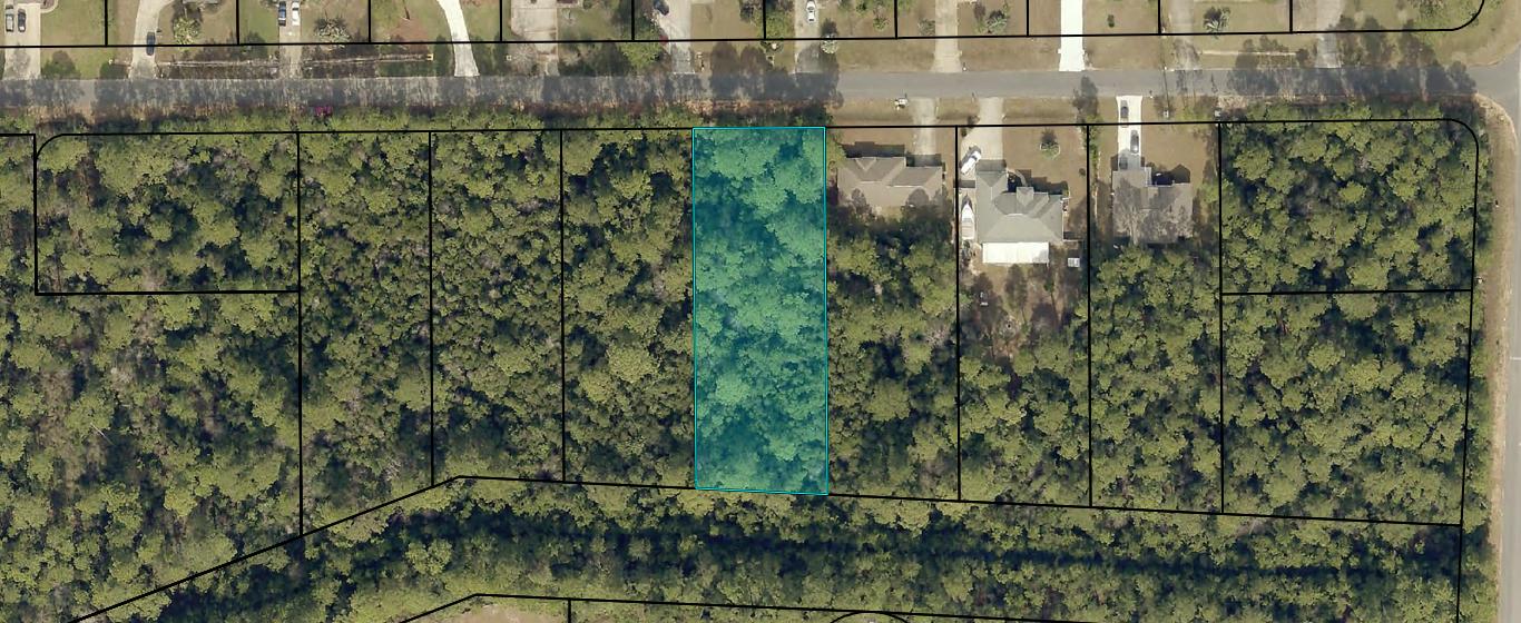 2399 Cove Road Navarre, FL 32566 - Photo 2 of 7 a view of a yard