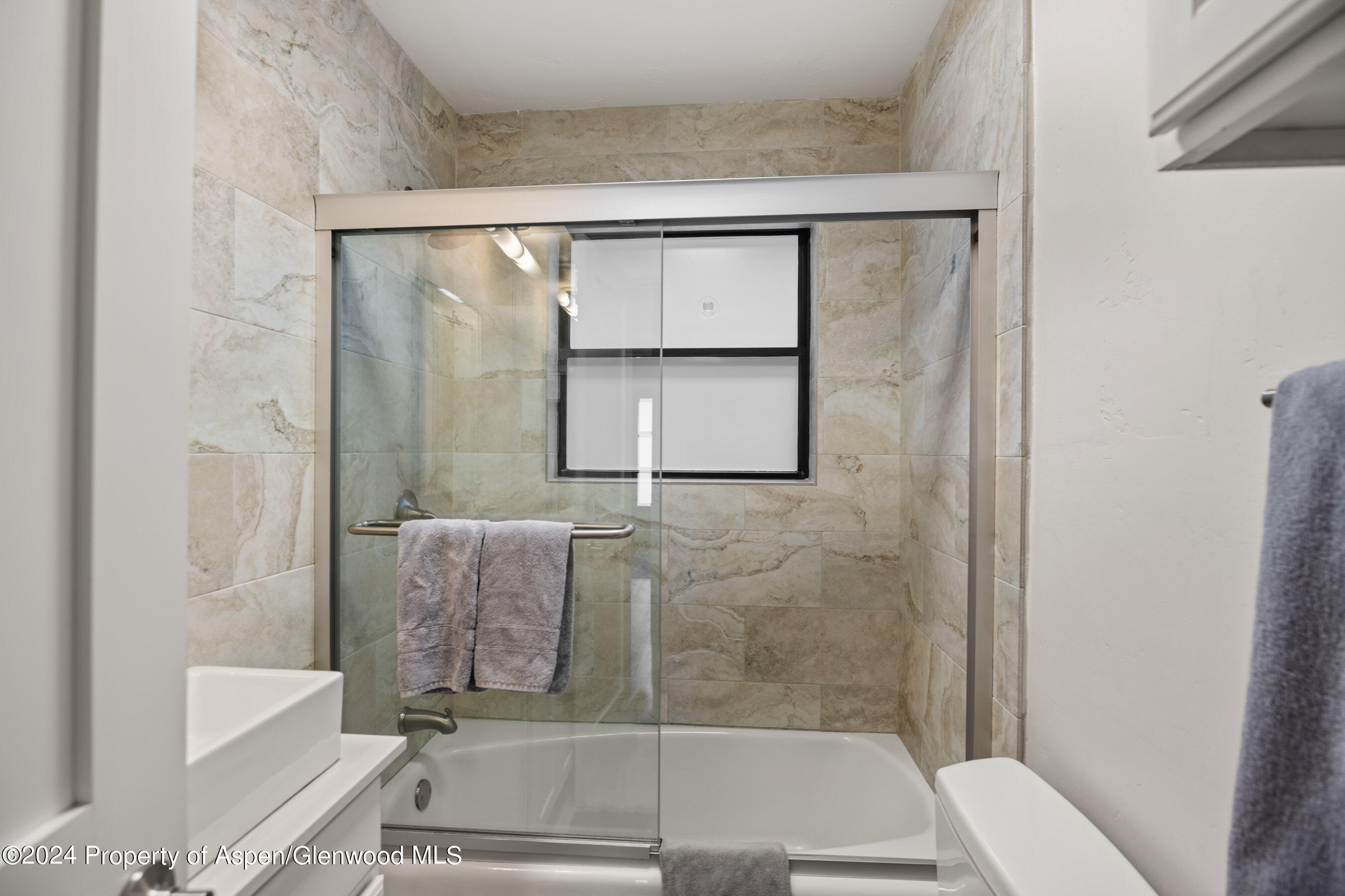 108 West Hyman Avenue, Unit 3 Aspen, CO 81611 - Photo 9 of 12 a bathroom with a tub and shower