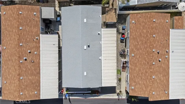 an aerial view of a building with parking space