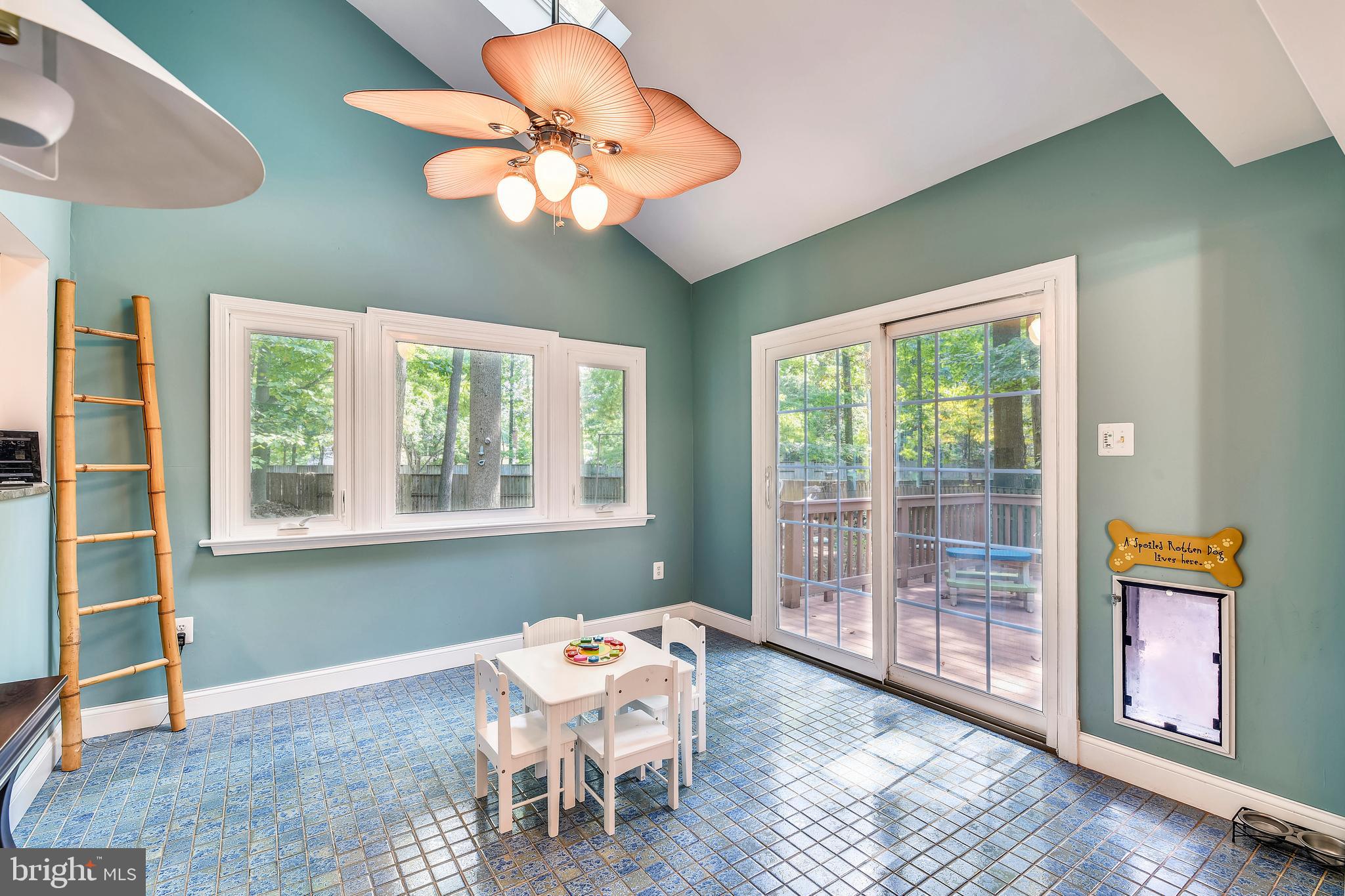 9317 Raintree Road Burke, VA 22015 - Photo 12 of 69 Light-filled sunroom with sliding doors to deck