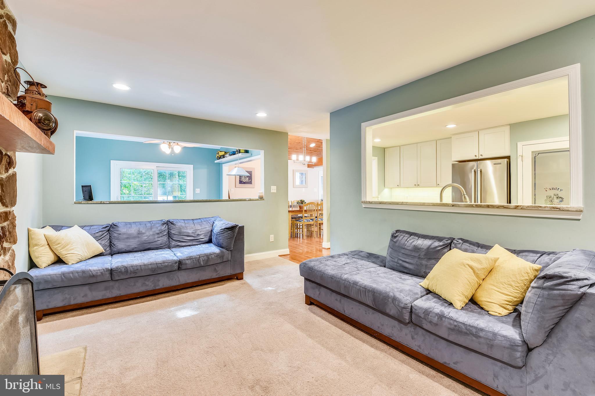 9317 Raintree Road Burke, VA 22015 - Photo 13 of 69 Family room with openings to kitchen and sunroom