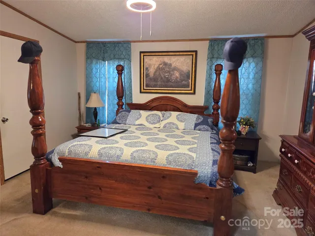 a bedroom with a bed and a mirror