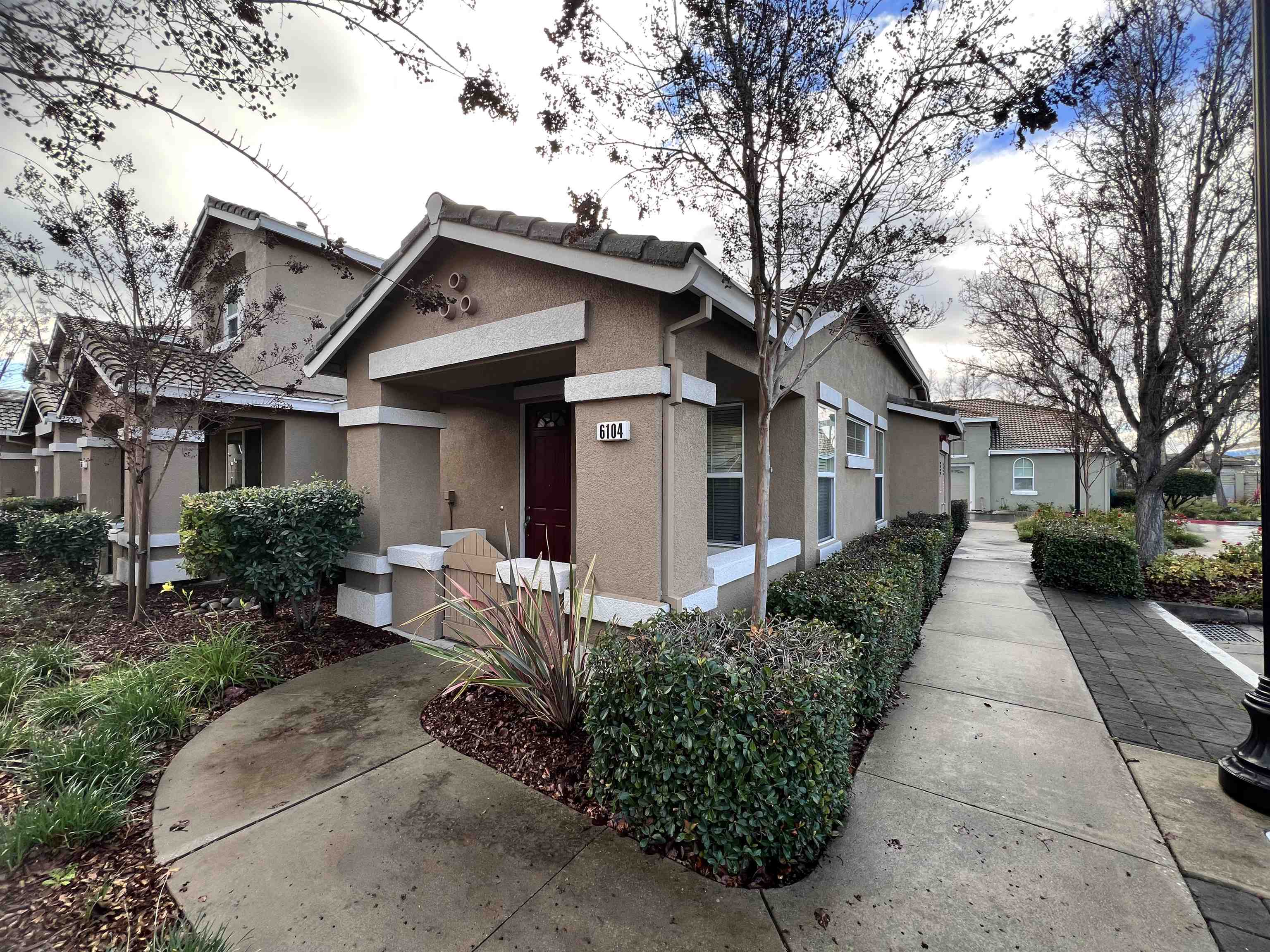 6104 Forget Me Not Livermore, CA 94551 - Photo 1 of 1 a front view of a house with a yard