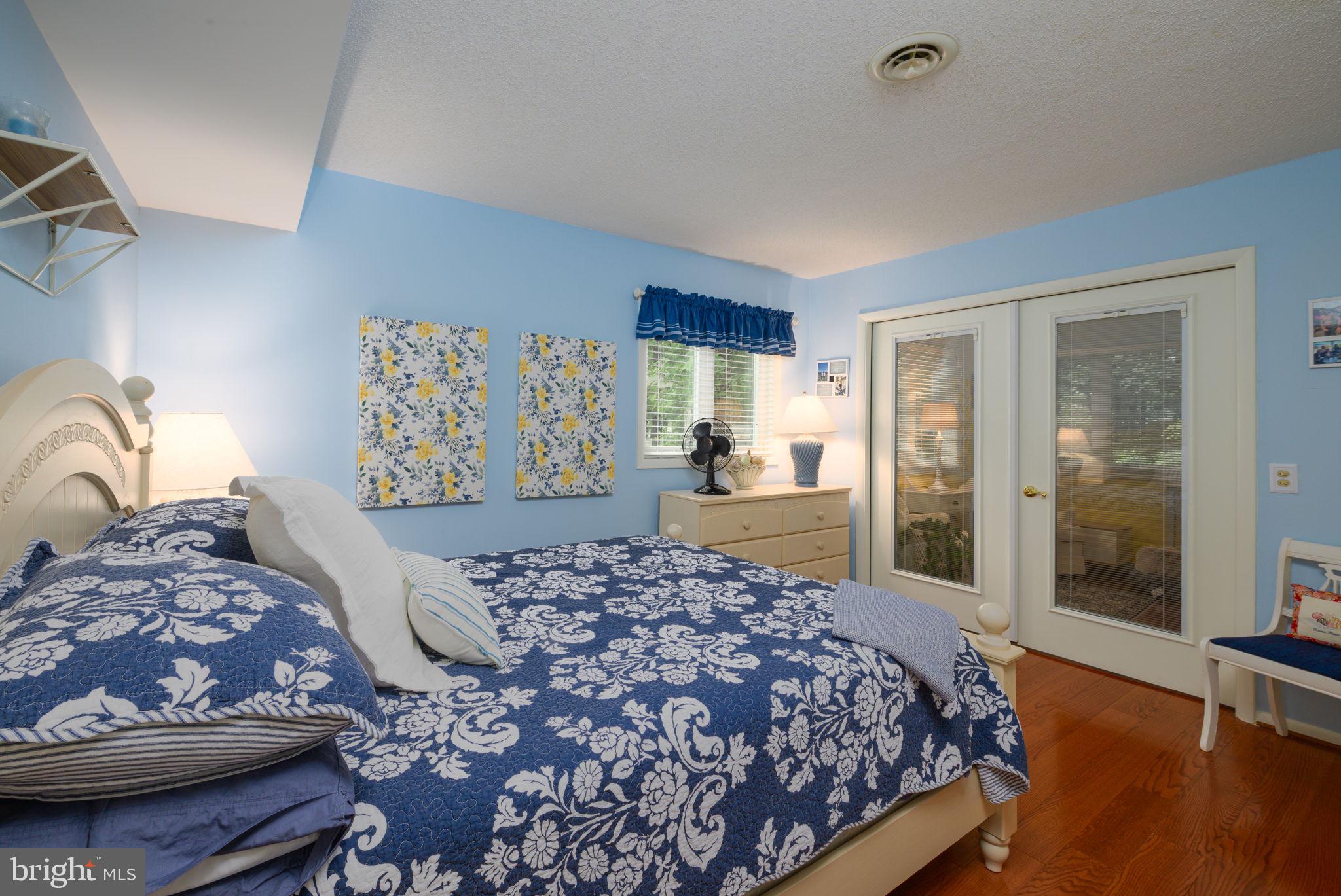 10 Gloucester Road Ocean Pines, MD 21811 - Photo 11 of 37 a bedroom with a large bed and a window
