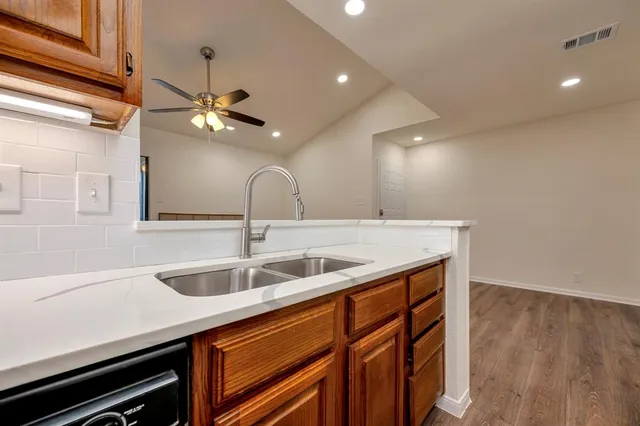 a kitchen with a sink and a microwave
