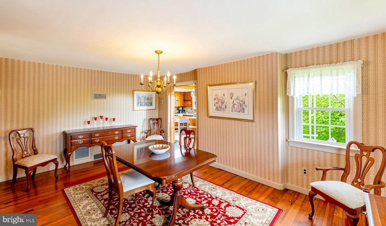222 Blue School Road Perkasie, PA 18944 - Photo 17 of 77 a view of a dining room with furniture window and wooden floor