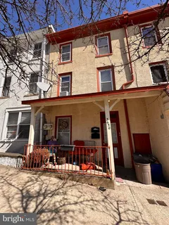 a view of a house with snow on the wall