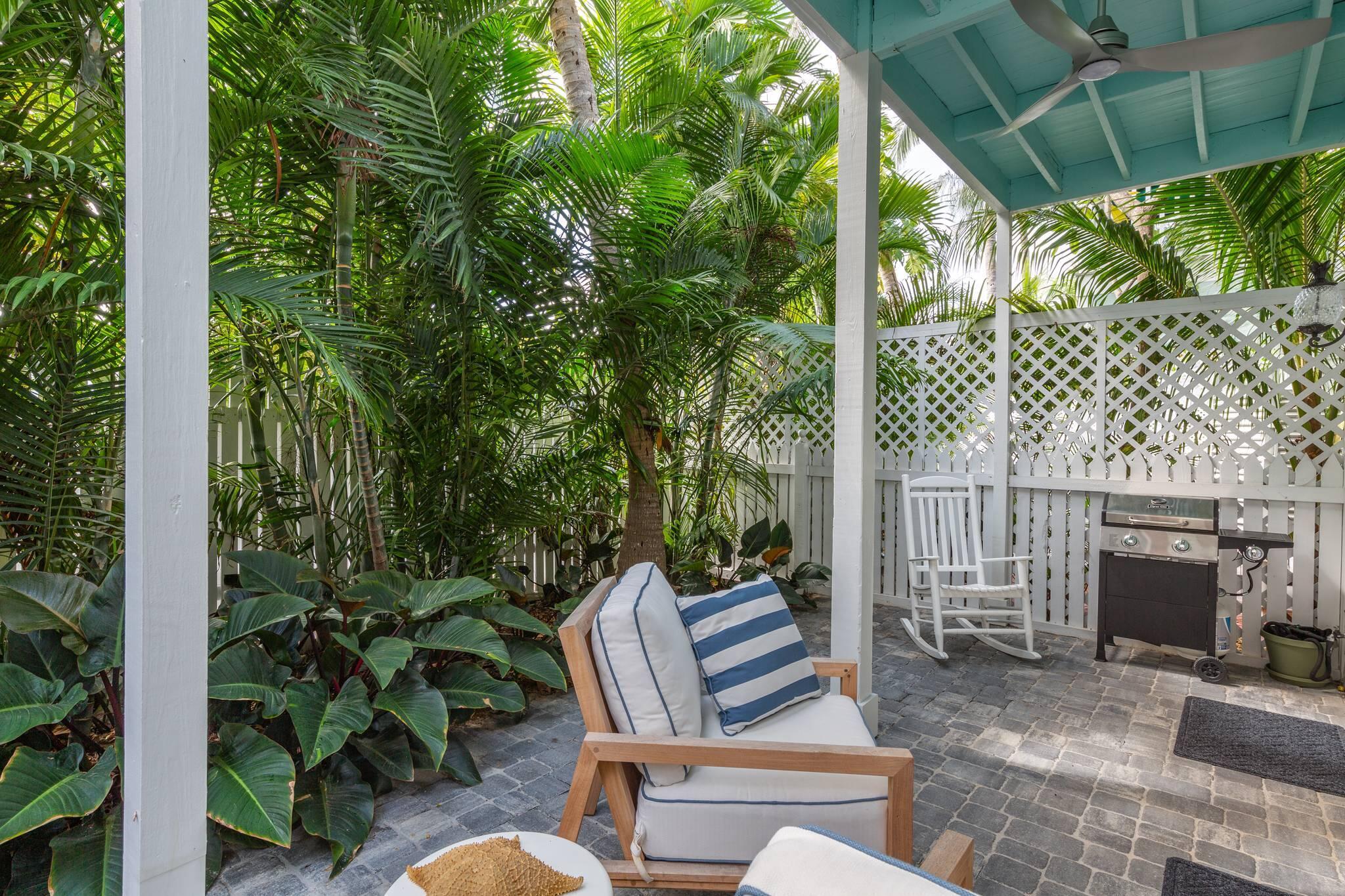 216 Fleming Street Key West, FL 33040 - Photo 18 of 33 a view of a porch with furniture and garden