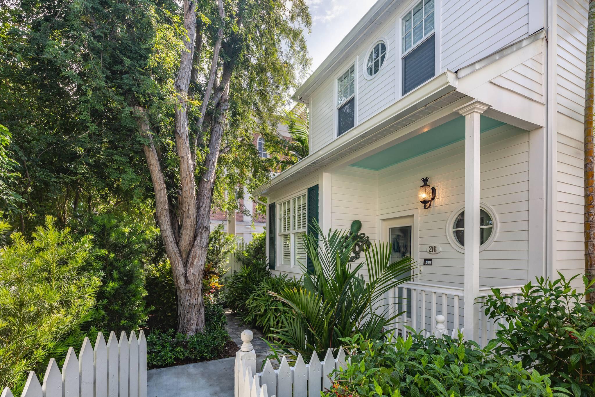 216 Fleming Street Key West, FL 33040 - Photo 2 of 33 a view of a house with a tree