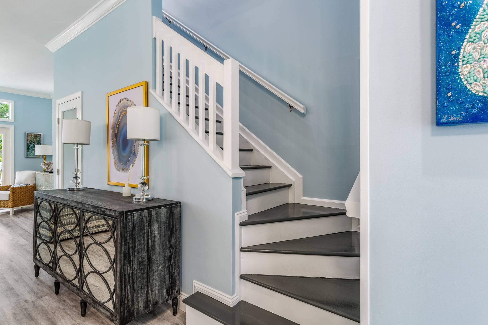 216 Fleming Street Key West, FL 33040 - Photo 21 of 33 a view of entryway livingroom and hall with wooden floor