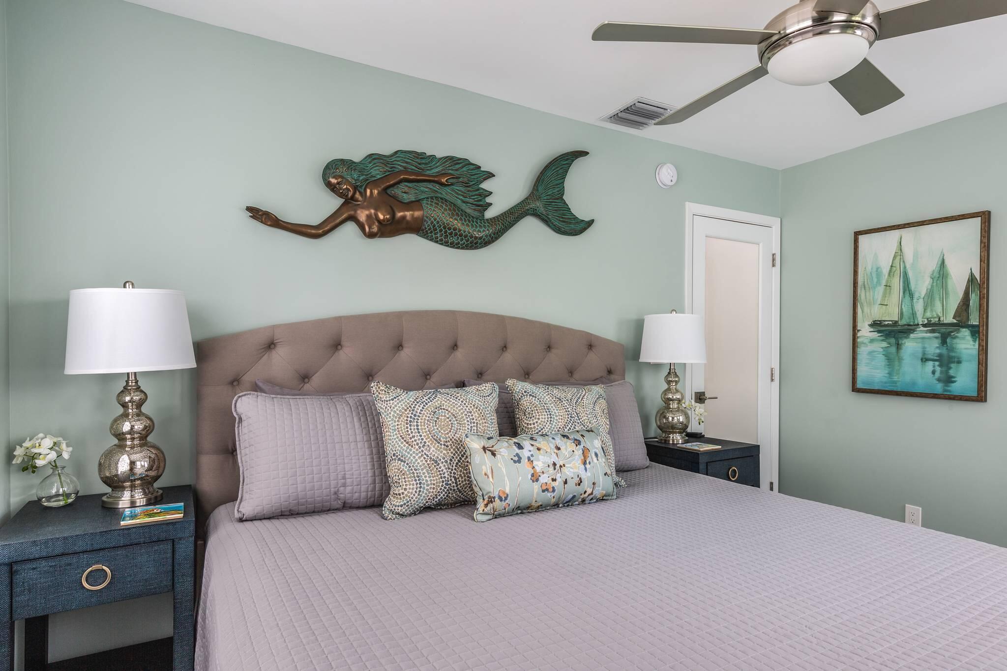 216 Fleming Street Key West, FL 33040 - Photo 28 of 33 a bedroom with a bed and a lamp