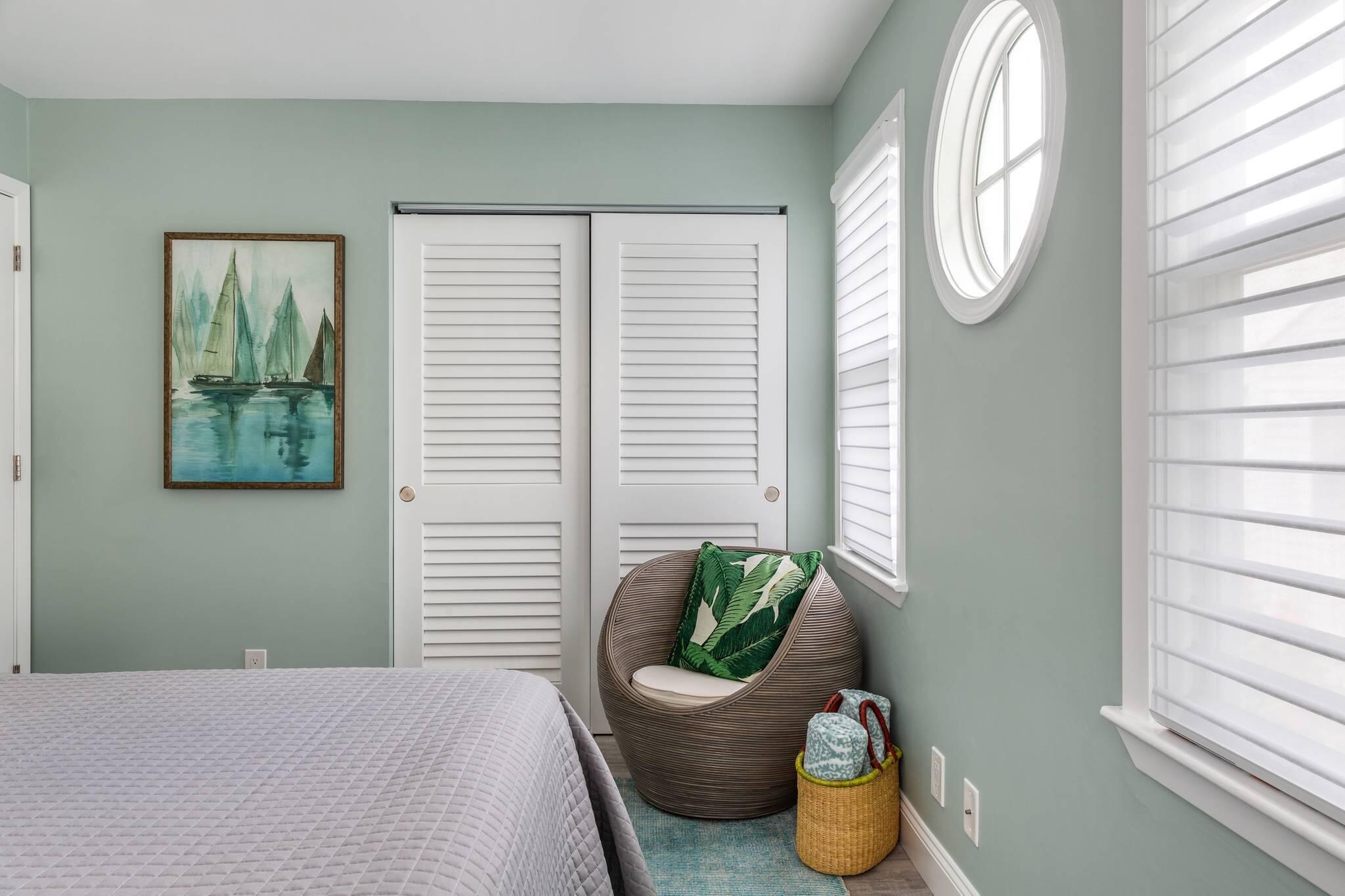 216 Fleming Street Key West, FL 33040 - Photo 29 of 33 a bedroom with a bed and flowerpot