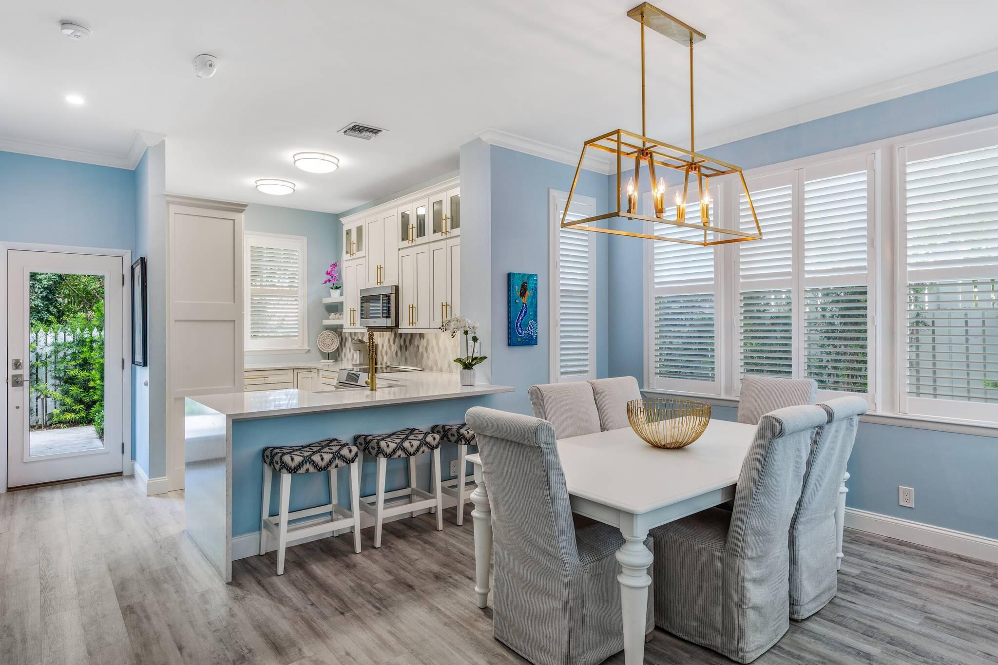 216 Fleming Street Key West, FL 33040 - Photo 4 of 33 a view of a dining room with furniture window and wooden floor
