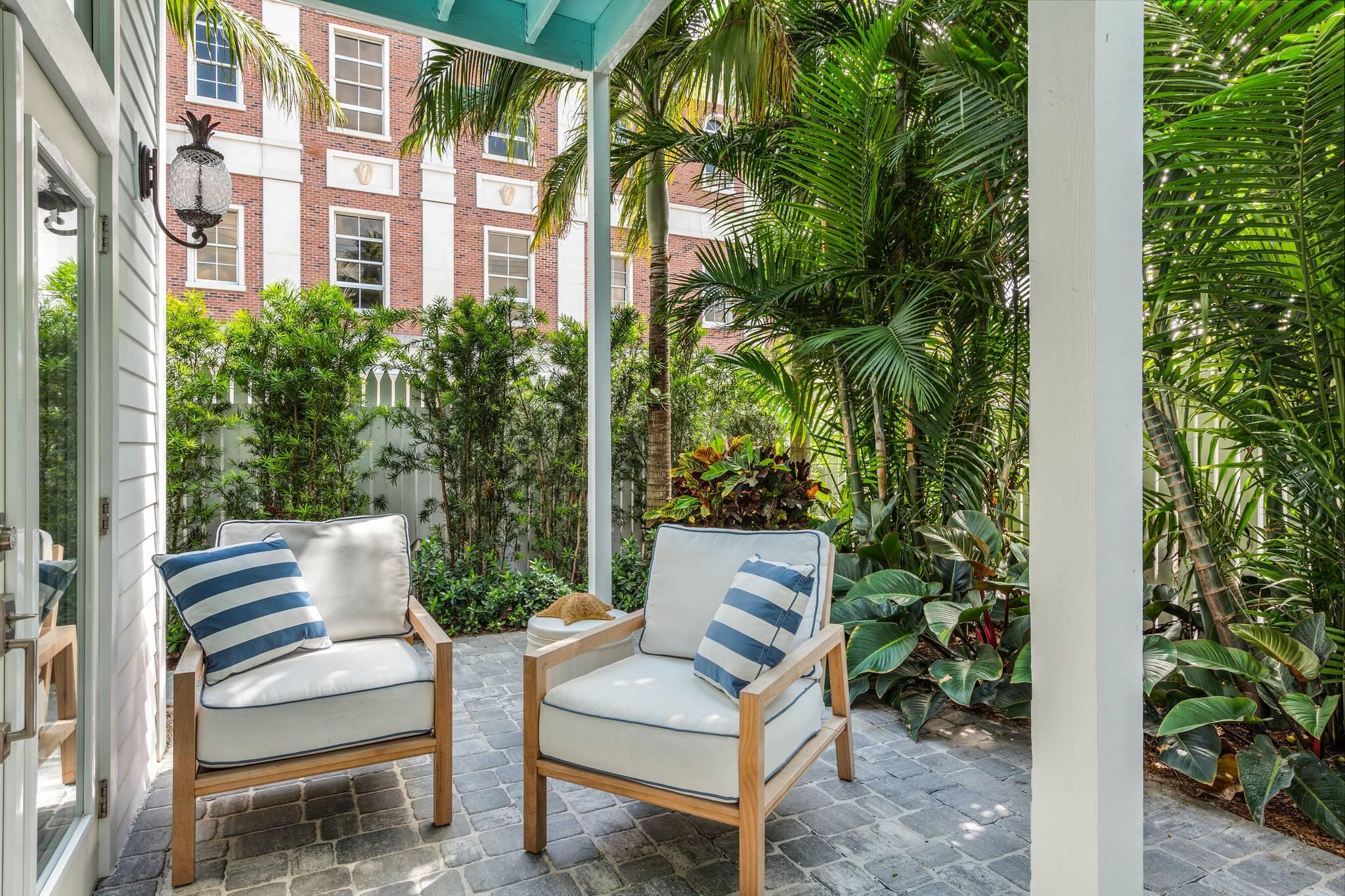 216 Fleming Street Key West, FL 33040 - Photo 5 of 33 a view of patio with couches and potted plants with sky view