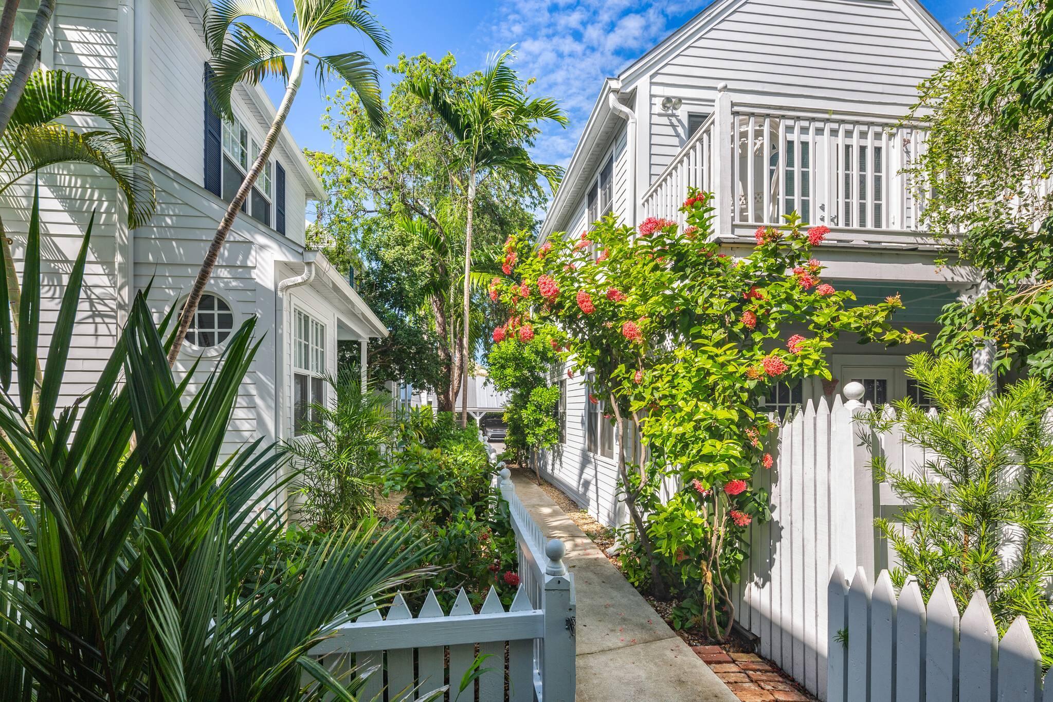 216 Fleming Street Key West, FL 33040 - Photo 7 of 33 a front view of a house with a yard
