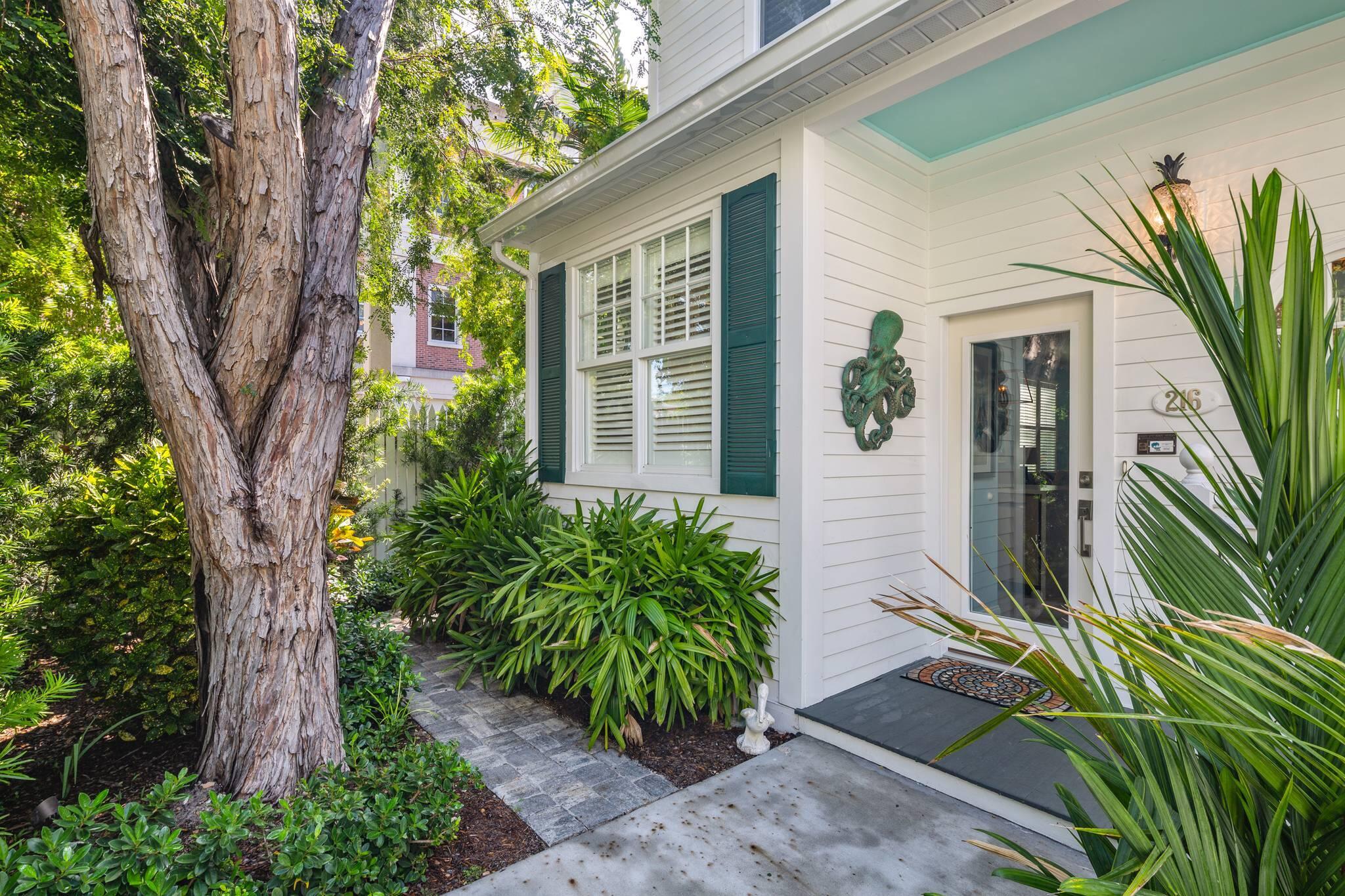 216 Fleming Street Key West, FL 33040 - Photo 8 of 33 a front view of a house with a tree