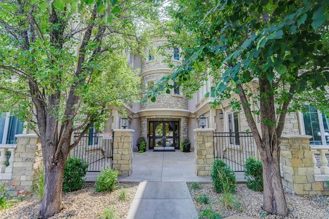 front view of a house with a tree