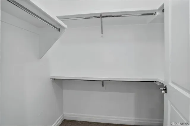 a view of an empty walk in closet