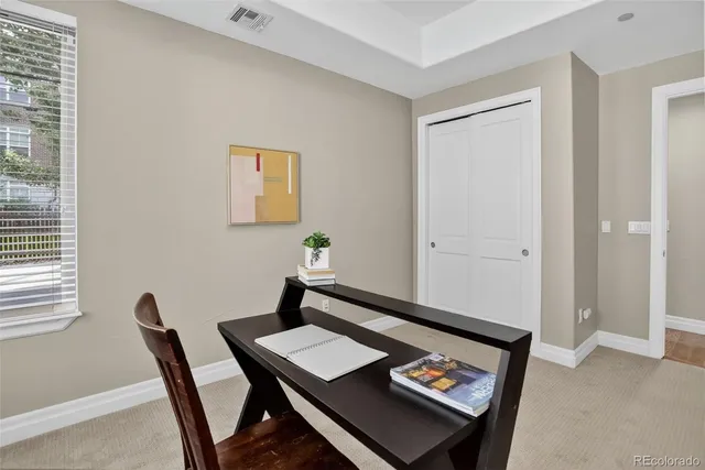 a view of a workspace with furniture