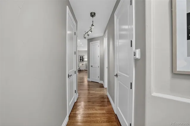 a view of a hallway with a dining area