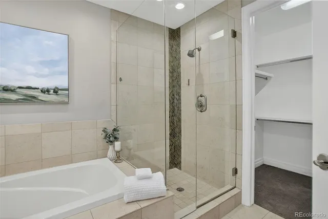 a bathroom with a glass shower door