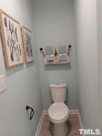 a bathroom with a toilet and a sink
