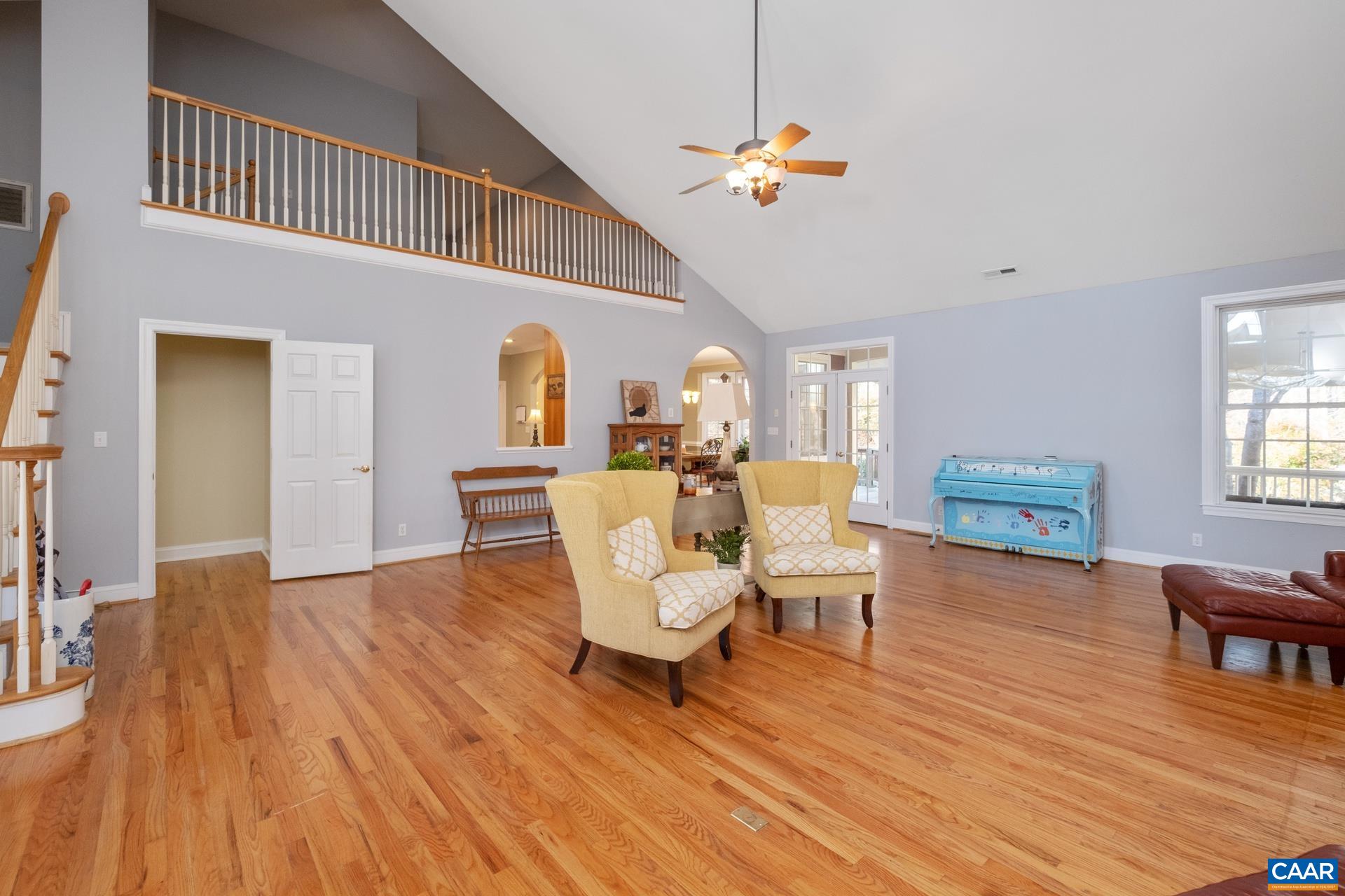 684 Campbell Road Keswick, VA 22947 - Photo 20 of 51 a living room with furniture and a chandelier