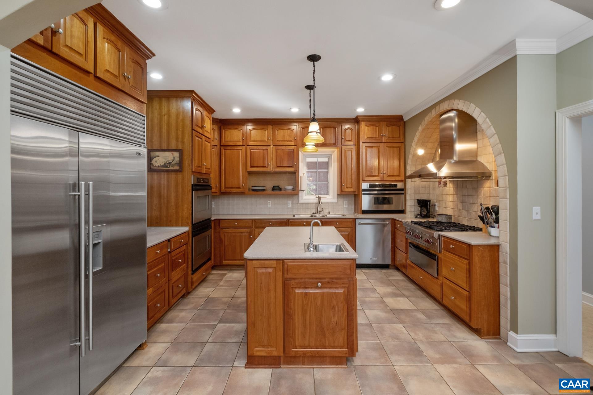 684 Campbell Road Keswick, VA 22947 - Photo 21 of 51 a kitchen with stainless steel appliances granite countertop a sink a stove and a refrigerator