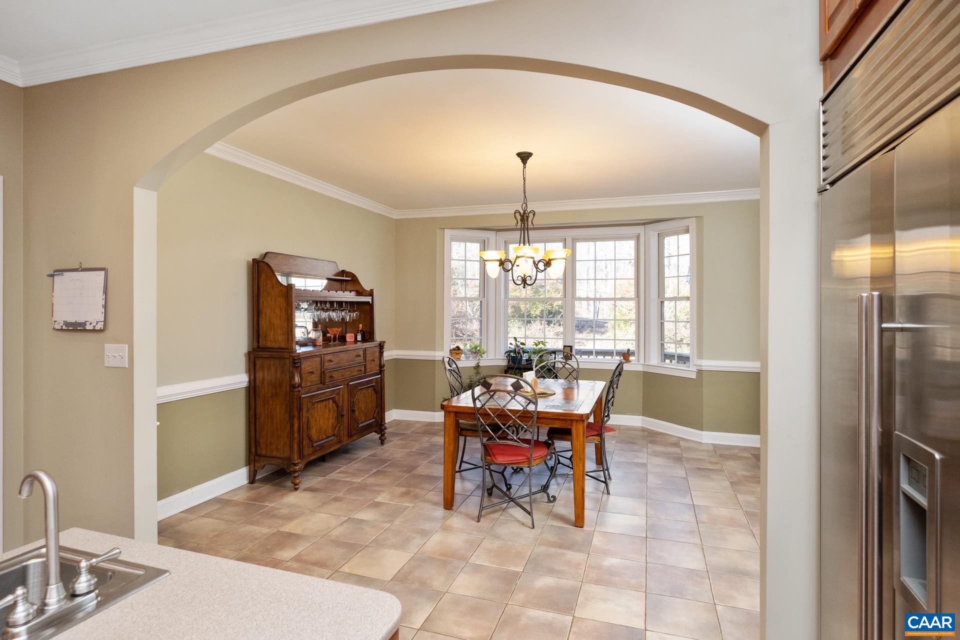 684 Campbell Road Keswick, VA 22947 - Photo 25 of 51 a view of a dining room with furniture window and outside view