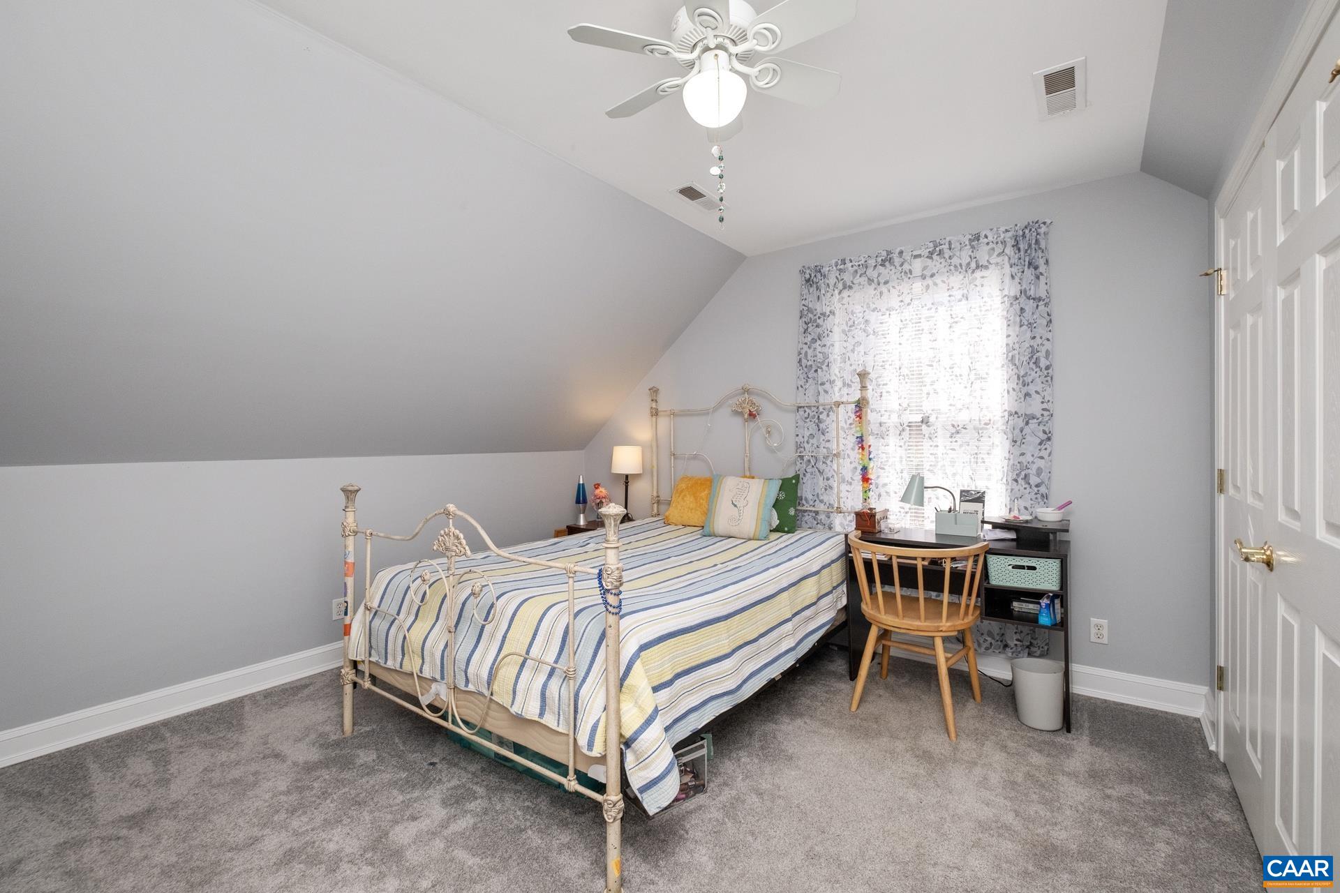 684 Campbell Road Keswick, VA 22947 - Photo 34 of 51 a bedroom with a bed and a window