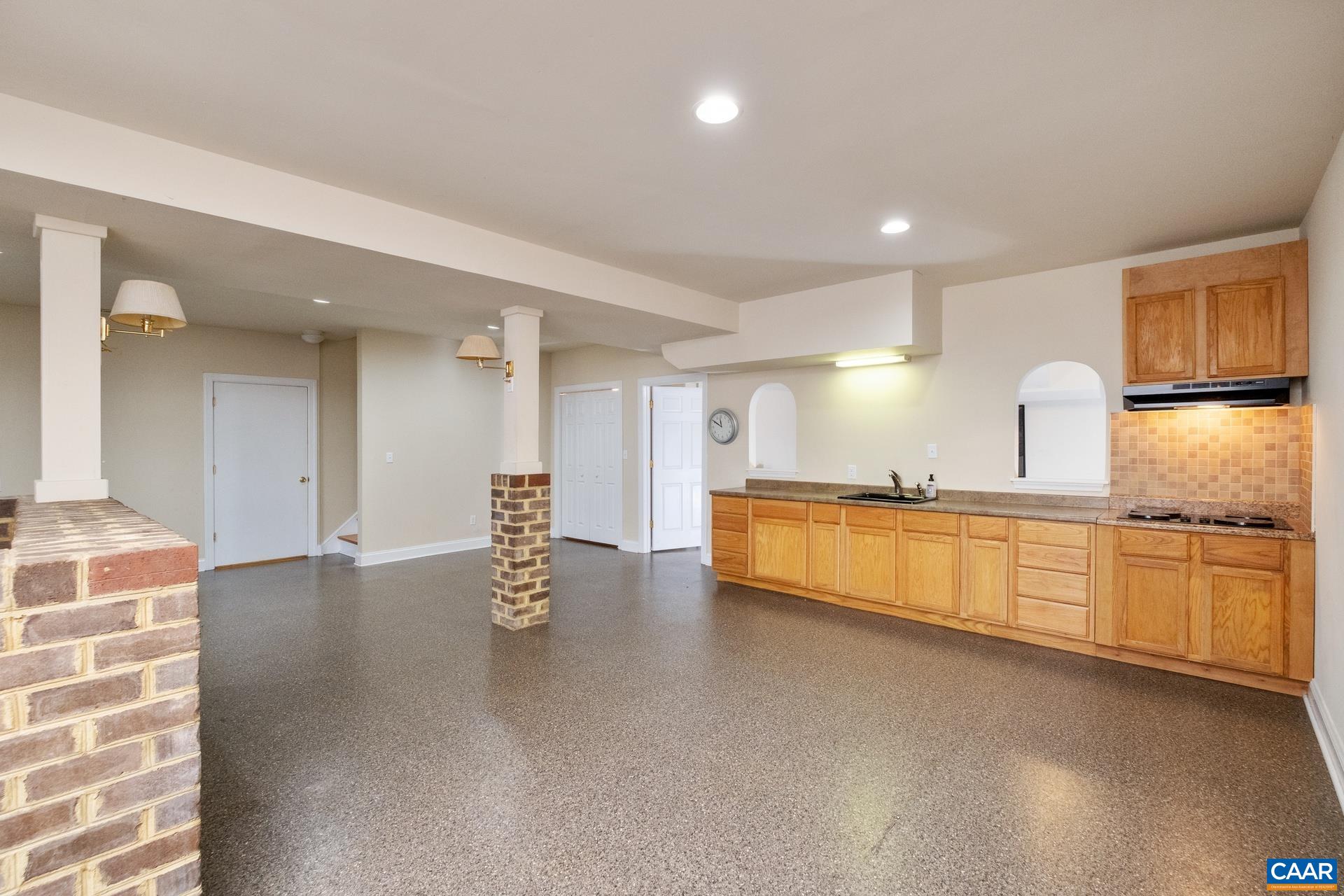 684 Campbell Road Keswick, VA 22947 - Photo 36 of 51 a large hall with stainless steel appliances granite countertop a granite counter tops and a stove