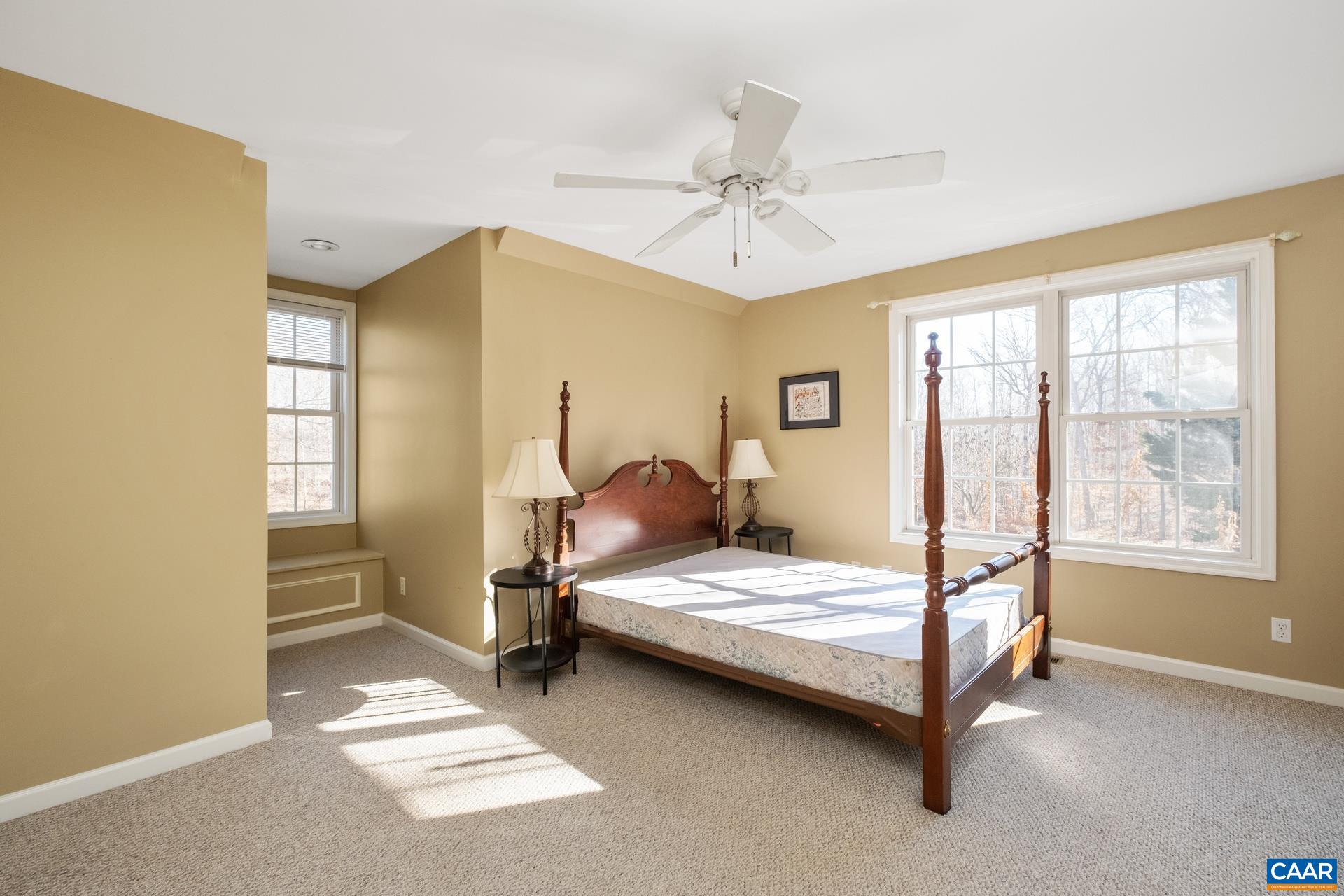684 Campbell Road Keswick, VA 22947 - Photo 49 of 51 a bedroom with a bed chair and window