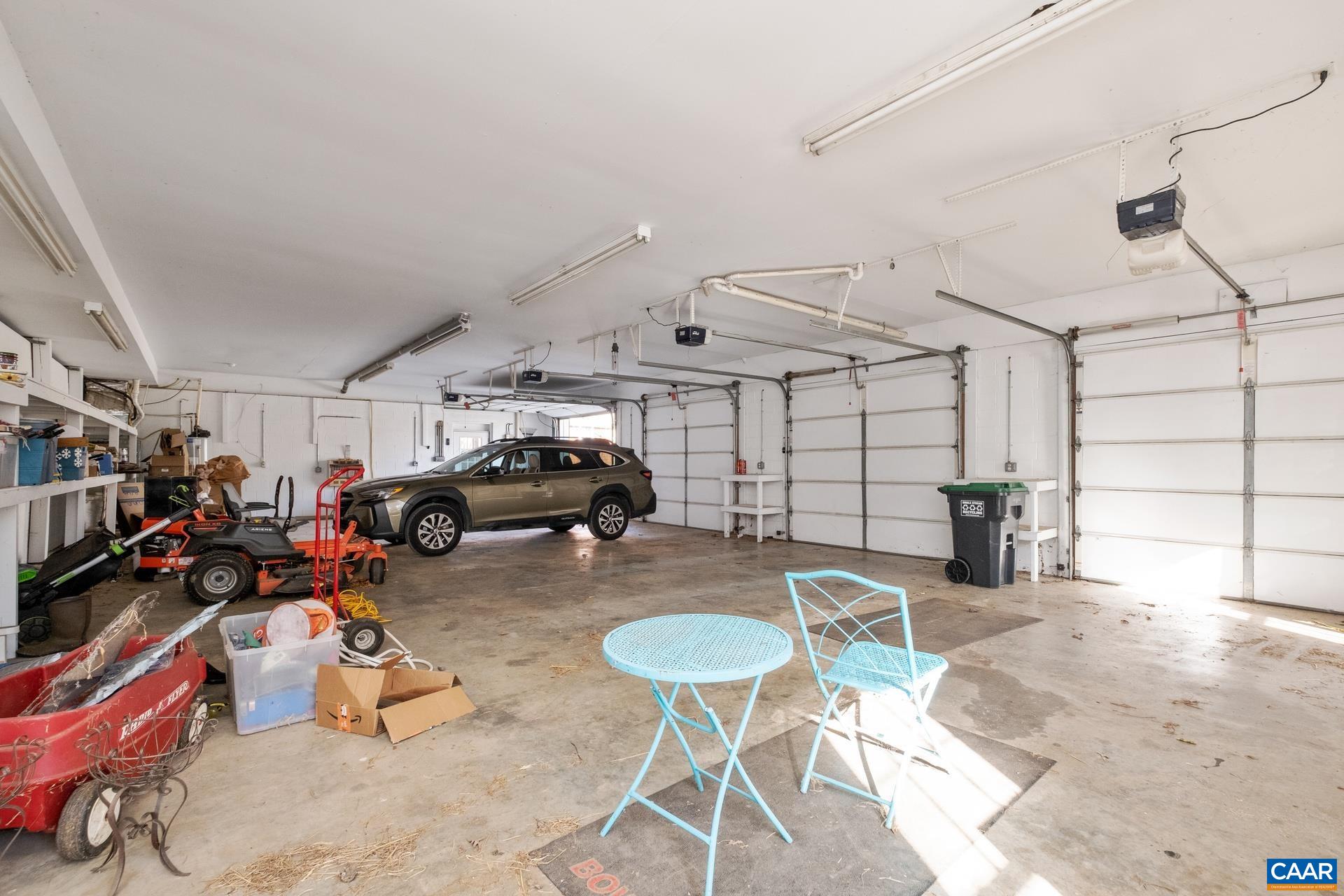 684 Campbell Road Keswick, VA 22947 - Photo 51 of 51 a view of a garage with a table and chairs