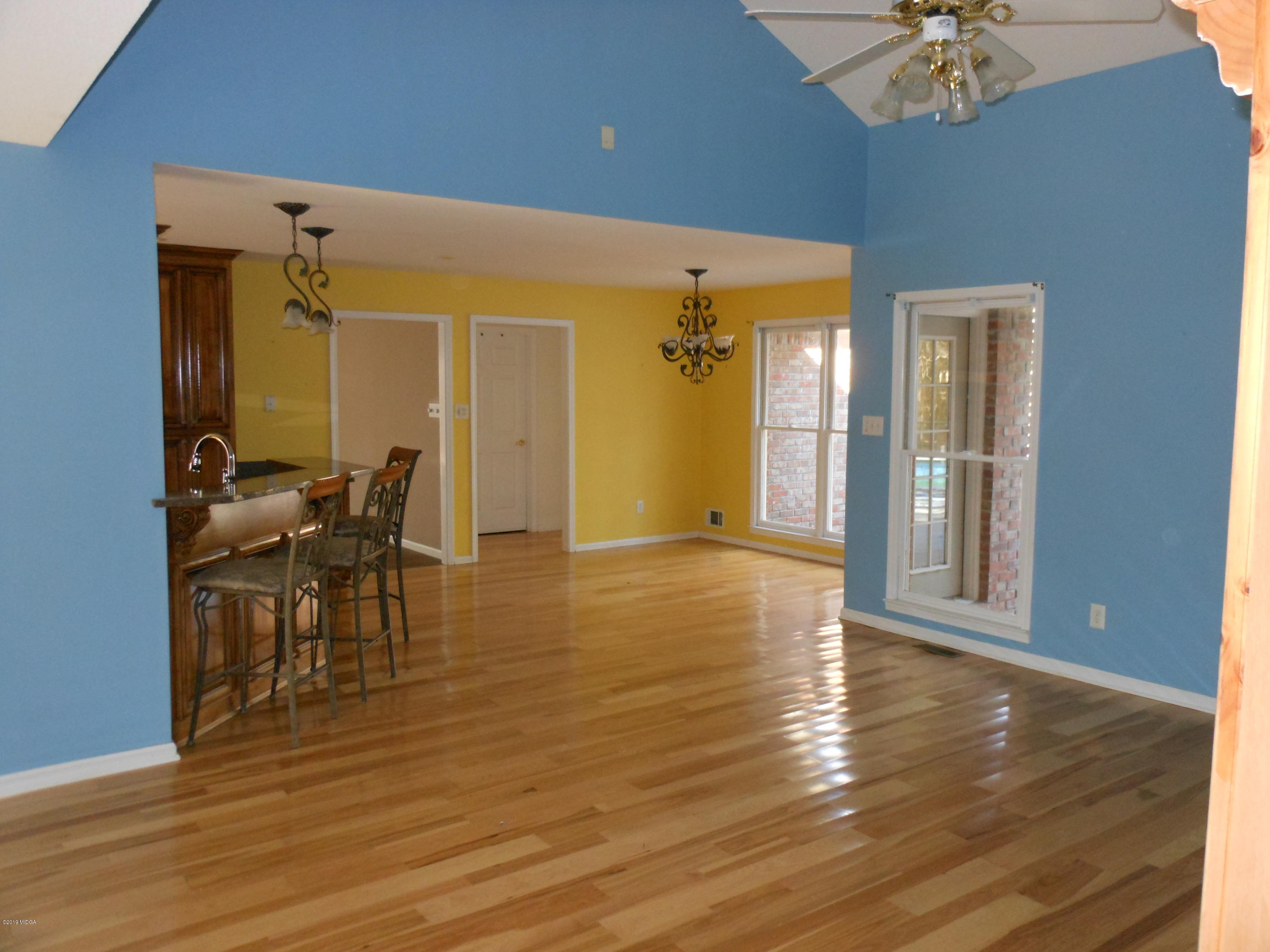 1248 Halls Bridge Road Jackson, GA 30233 - Photo 13 of 25 a view of a livingroom with furniture and a chandelier