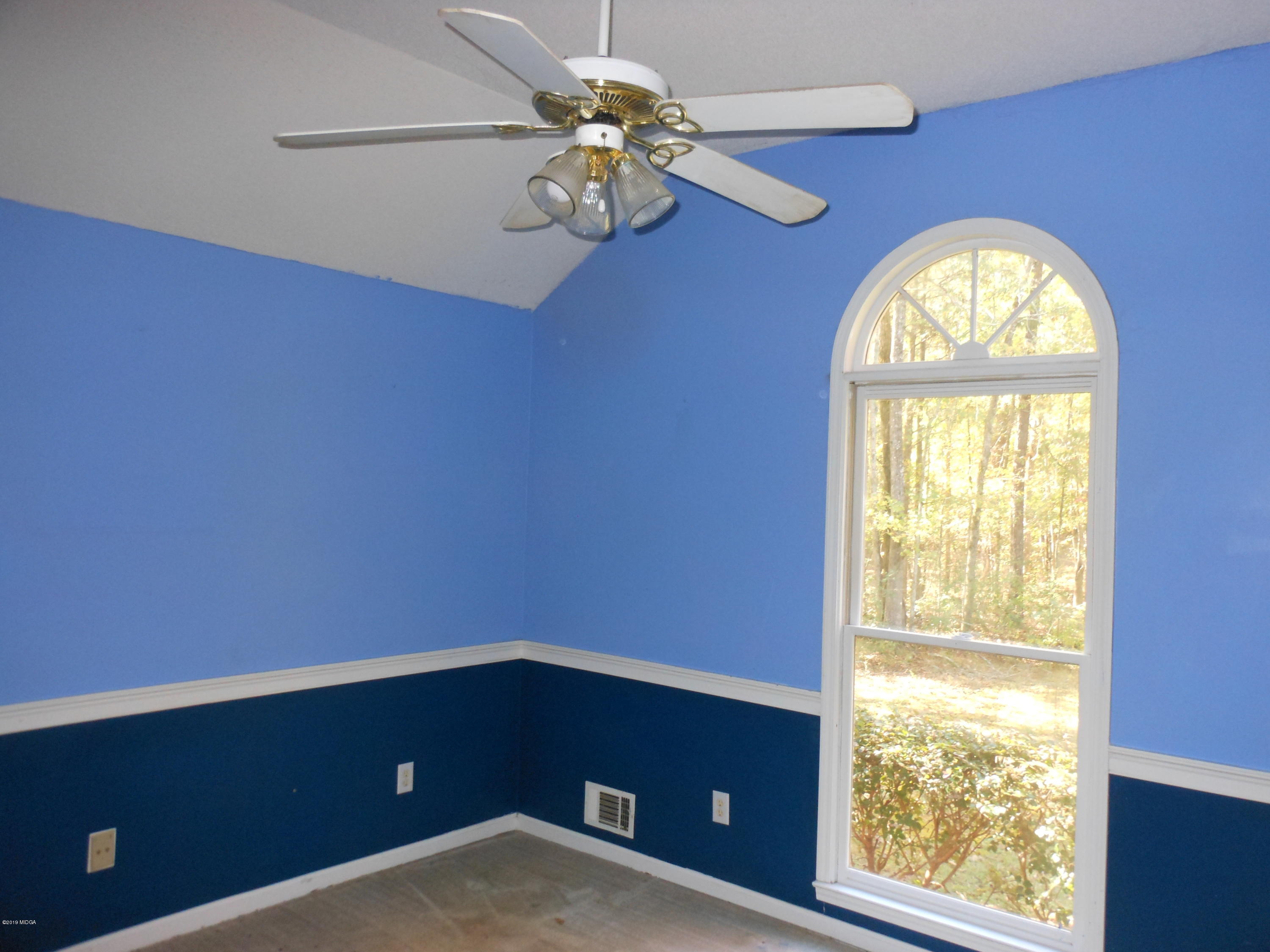 1248 Halls Bridge Road Jackson, GA 30233 - Photo 18 of 25 a view of an empty room with a window