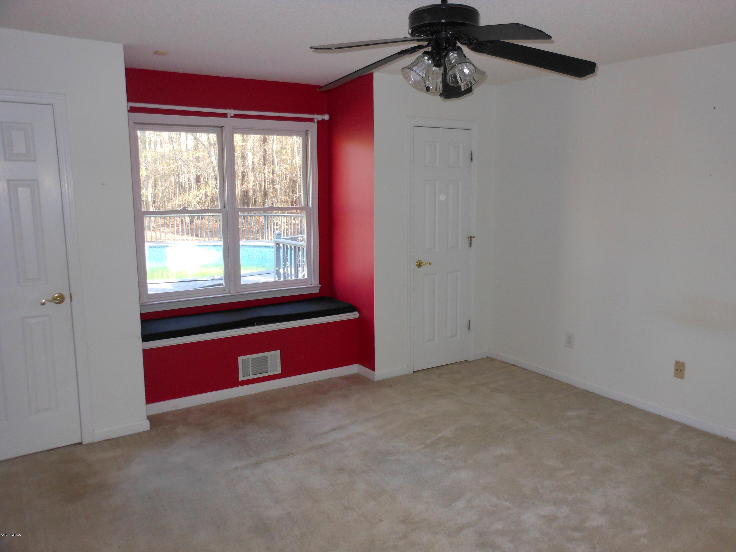 1248 Halls Bridge Road Jackson, GA 30233 - Photo 19 of 25 an empty room with windows