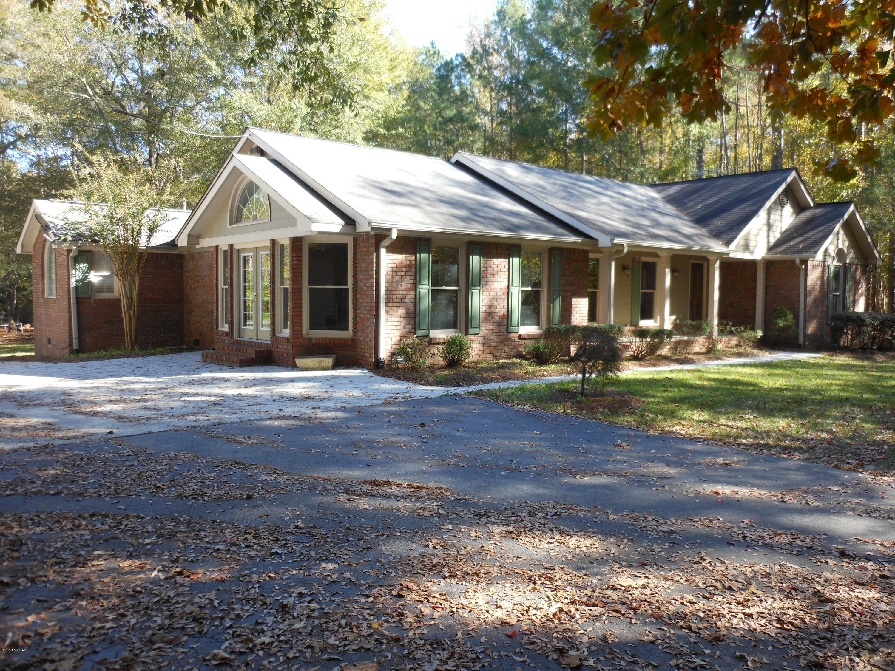 1248 Halls Bridge Road Jackson, GA 30233 - Photo 3 of 25 a front view of a house with garden