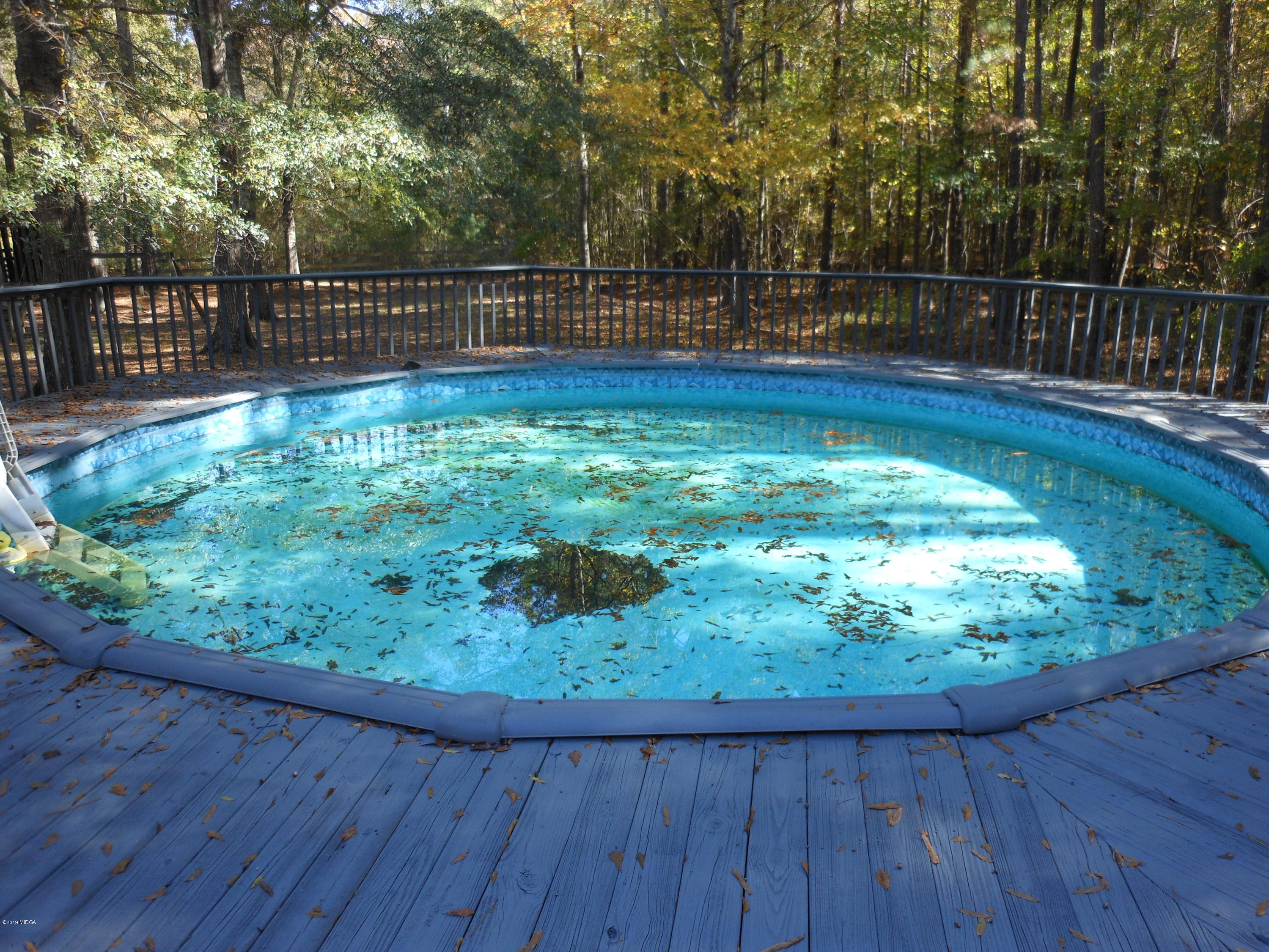 1248 Halls Bridge Road Jackson, GA 30233 - Photo 24 of 25 a view of a backyard with a wooden fence