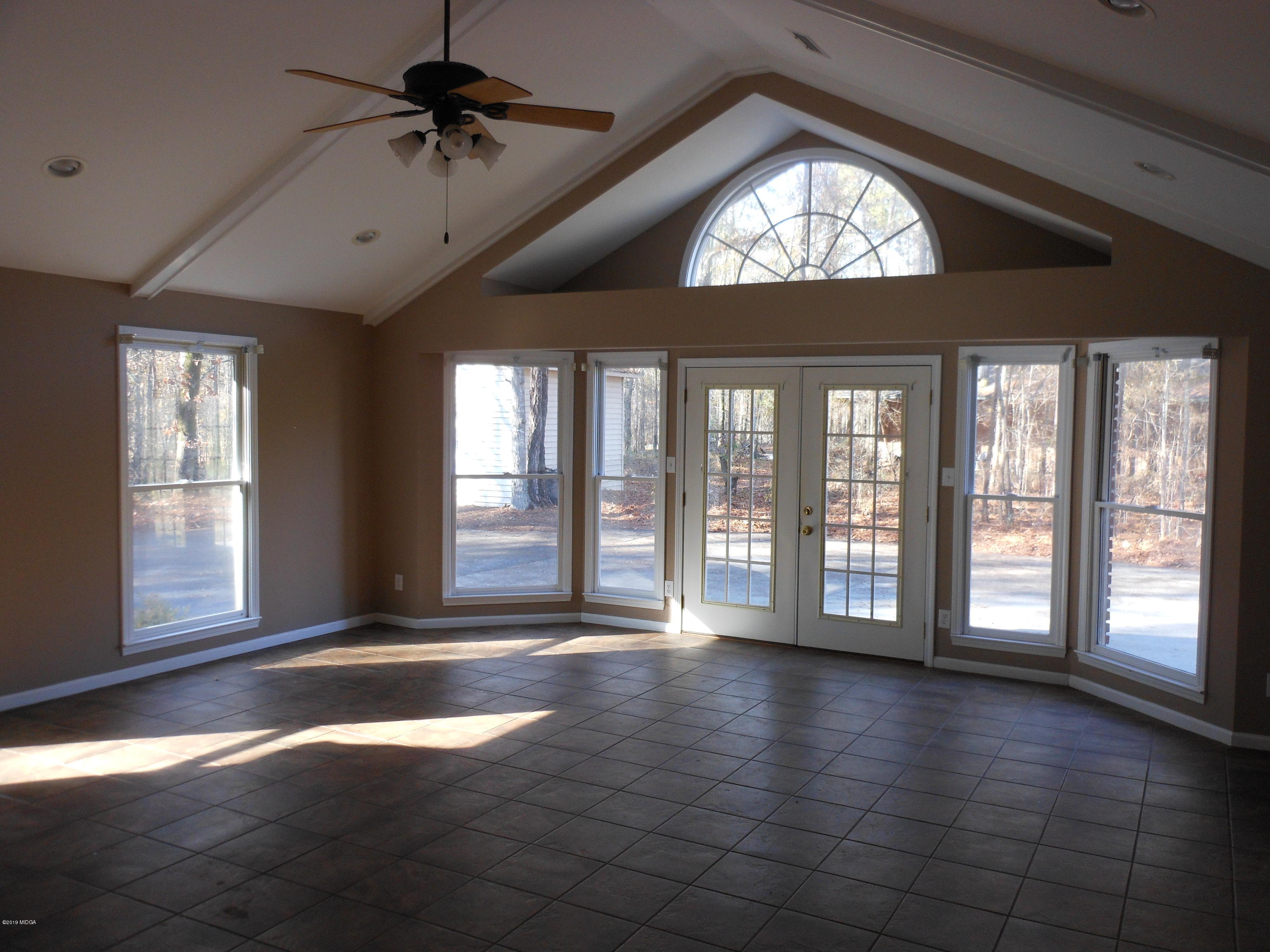 1248 Halls Bridge Road Jackson, GA 30233 - Photo 7 of 25 a view of an empty room with a window
