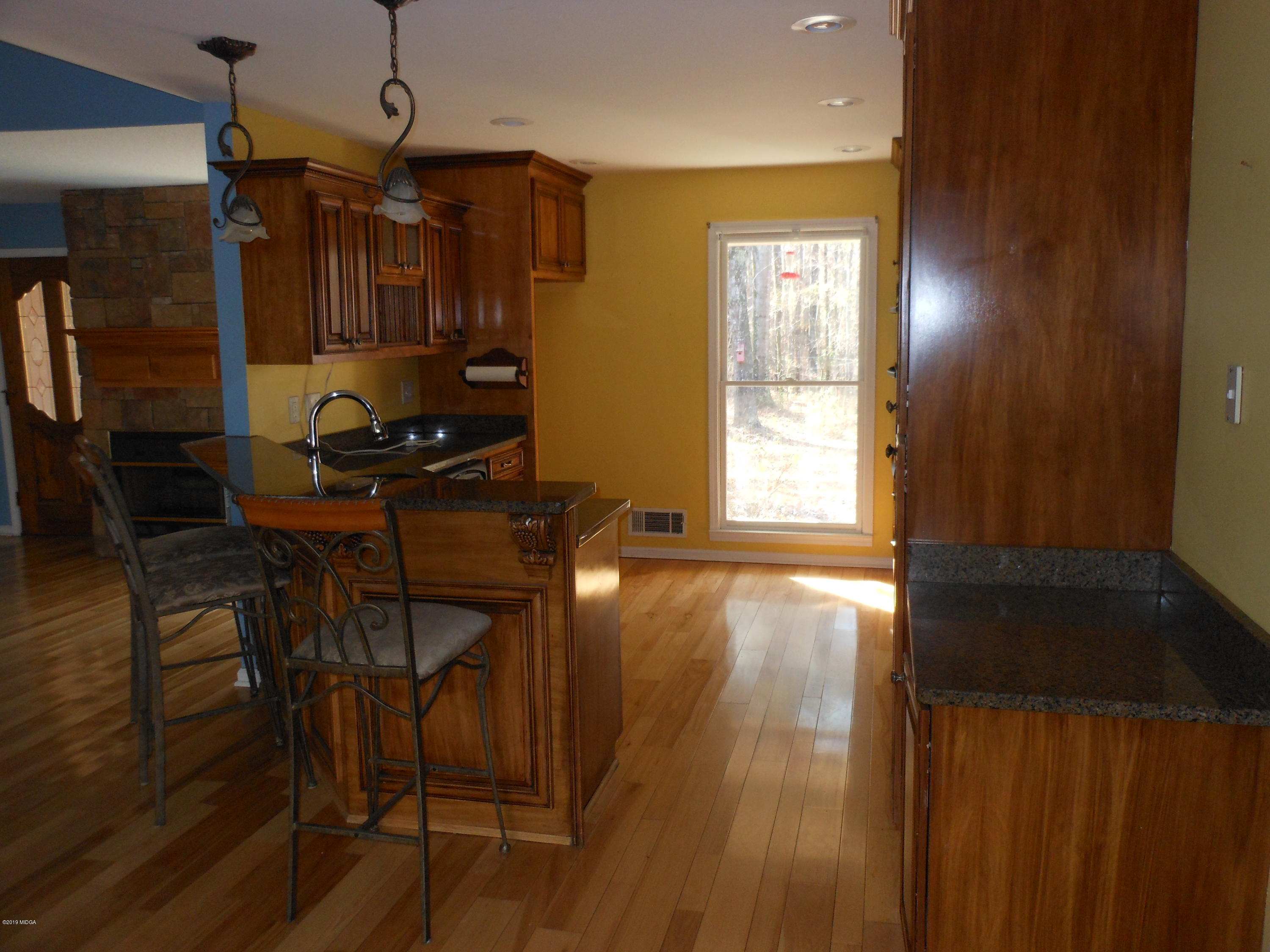 1248 Halls Bridge Road Jackson, GA 30233 - Photo 10 of 25 a view of a room with gym equipment