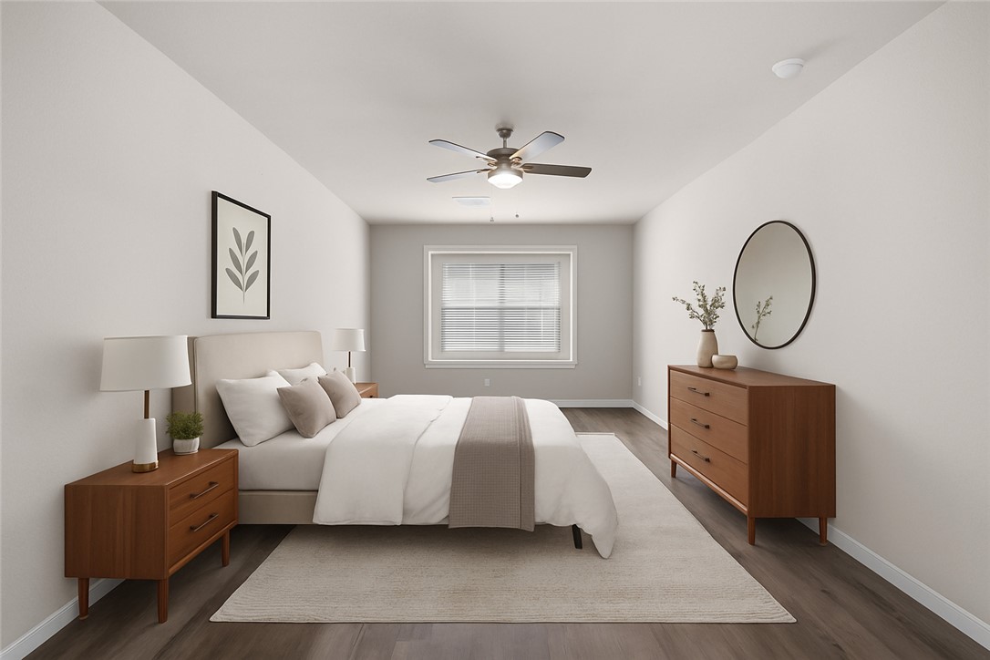 974 Harper Lane Bryan, TX 77803 - Photo 17 of 38 Bedroom featuring dark wood-type flooring and ceiling fan