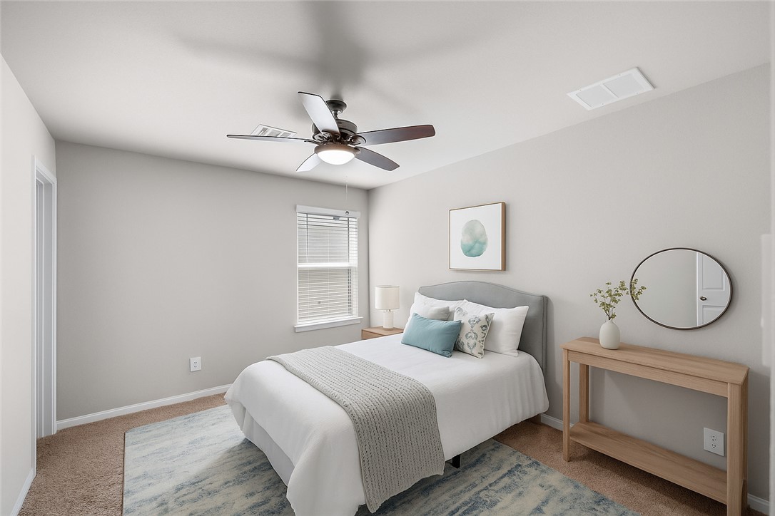 974 Harper Lane Bryan, TX 77803 - Photo 27 of 38 Carpeted bedroom with ceiling fan and baseboards