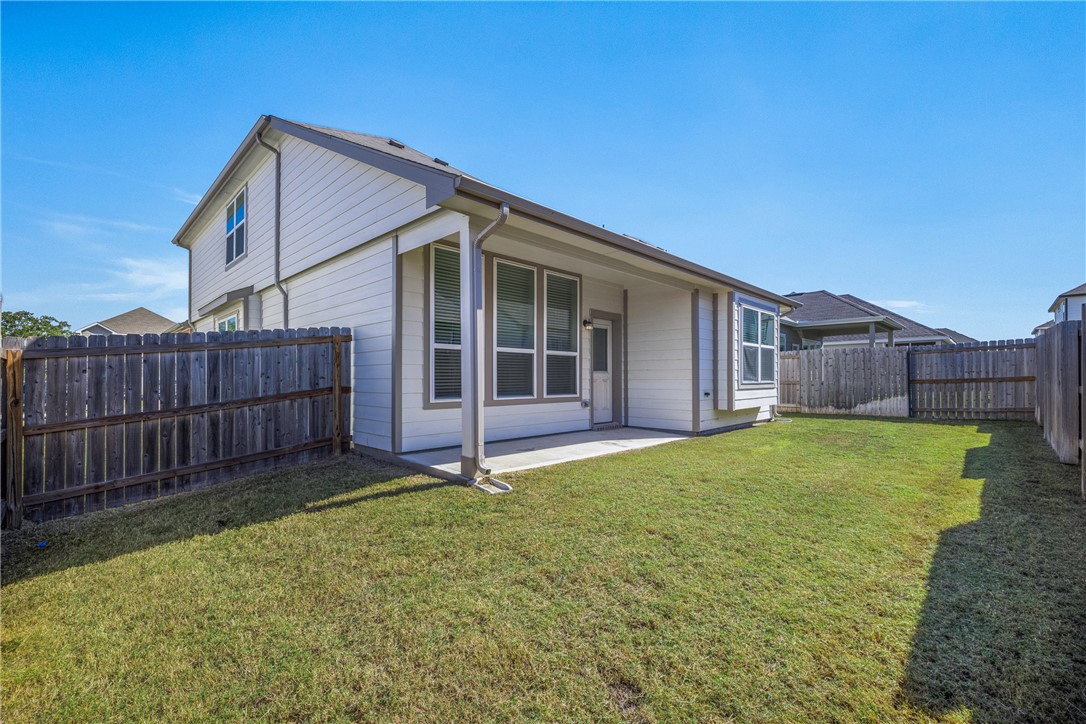 974 Harper Lane Bryan, TX 77803 - Photo 34 of 38 Back of property featuring a patio area and a fenced backyard