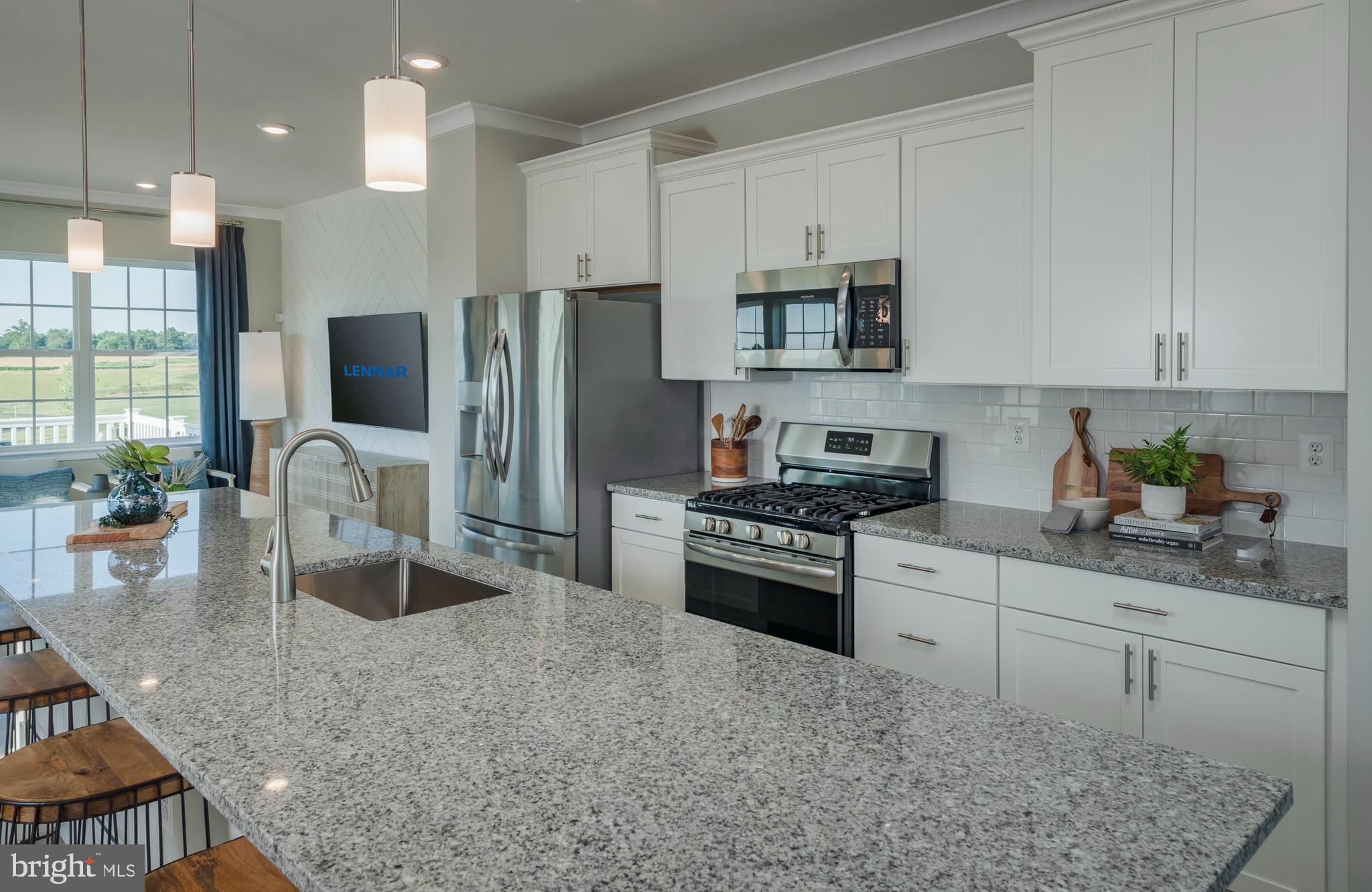 1845 Ritter Road Windsor Mill, MD 21244 - Photo 5 of 14 a kitchen with stainless steel appliances granite countertop a stove refrigerator sink and cabinets