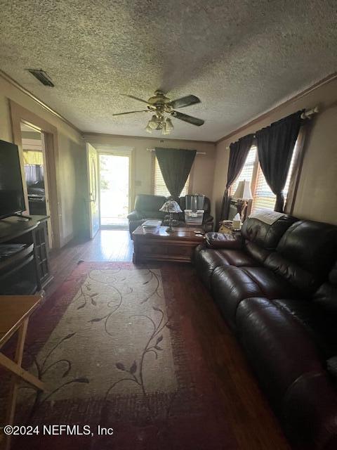 54178 Fouracre Circle Callahan, FL 32011 - Photo 4 of 12 a living room with furniture and a chandelier