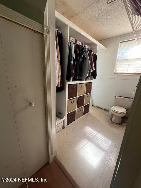 54178 Fouracre Circle Callahan, FL 32011 - Photo 6 of 12 a view of walk in closet with clothes and shoes