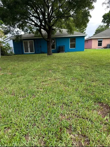 a house with a tree in front of it